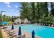 Community pool and clubhouse area with plenty of seating and umbrellas at 1322 Stanley Park Dr, Decatur, GA 30033