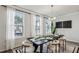 Elegant dining area with ample natural light, stylish seating, and modern chandelier at 1322 Stanley Park Dr, Decatur, GA 30033