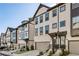 Modern townhome exteriors featuring neutral siding, dark trim, and attached garages, perfect for sophisticated urban living at 1322 Stanley Park Dr, Decatur, GA 30033