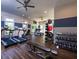 Bright gym featuring updated equipment, ceiling fans, a wall-mounted television and weight-training equipment at 1322 Stanley Park Dr, Decatur, GA 30033