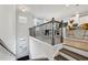 Bright interior view with modern staircase and a glimpse of the stylish kitchen at 1322 Stanley Park Dr, Decatur, GA 30033