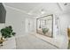 Cozy main bedroom showcasing a four-poster bed, soft carpet, and tray ceiling at 1322 Stanley Park Dr, Decatur, GA 30033