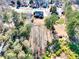 Aerial view of a home nestled among lush greenery and mature trees in a serene setting at 3064 Zermatt Way, Snellville, GA 30078