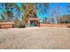 Backyard featuring a wooden pergola and perimeter fence at 3064 Zermatt Way, Snellville, GA 30078