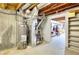 Unfinished basement featuring water heater and HVAC system with concrete walls and floors at 3064 Zermatt Way, Snellville, GA 30078