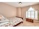 Cozy bedroom featuring a twin bed, carpet flooring, and a bright window at 3064 Zermatt Way, Snellville, GA 30078