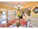 Bright dining area with a glass-top table, stylish chairs, and a view into the living room at 3064 Zermatt Way, Snellville, GA 30078