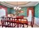 Elegant dining room with traditional furnishings and decorative wallpaper, creating a sophisticated ambiance at 3064 Zermatt Way, Snellville, GA 30078