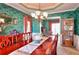 Classic dining room with a long wooden table, traditional chairs, and ornate decor, perfect for formal dining at 3064 Zermatt Way, Snellville, GA 30078