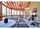 Comfortable screened porch featuring a ceiling fan, tiled floor, and ample seating at 3064 Zermatt Way, Snellville, GA 30078