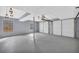 Spacious garage with painted floor and walls, featuring two garage doors at 6684 Heathrow Ln, Stone Mountain, GA 30087