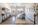 Elegant dining room showcasing hardwood floors, modern light fixture and doorway to the front porch at 124 Prescott Dr, Canton, GA 30114