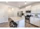 Well-lit kitchen featuring stainless steel appliances, white cabinetry, granite countertops and a center island at 124 Prescott Dr, Canton, GA 30114