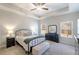 Spacious main bedroom with trey ceilings, two windows, black furnishings, and neutral carpet at 124 Prescott Dr, Canton, GA 30114