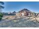 Large backyard with a brick home, patio, and lawn at 2477 Misty Rose Ln, Loganville, GA 30052