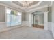 Traditional dining room with chandelier, archway, and white trim at 2477 Misty Rose Ln, Loganville, GA 30052
