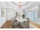 Traditional dining room with hardwood floors, chandelier, and plenty of natural light at 2477 Misty Rose Ln, Loganville, GA 30052