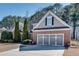 Attractive brick house with a three-car garage and well-maintained landscaping at 2477 Misty Rose Ln, Loganville, GA 30052