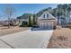 Charming home with a brick facade, well-manicured lawn, and a three car garage at 2477 Misty Rose Ln, Loganville, GA 30052