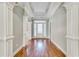 Beautiful foyer with hardwood flooring, white trim, and abundant natural light at 2477 Misty Rose Ln, Loganville, GA 30052