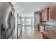 Bright kitchen with stainless steel appliances, granite countertops, and hardwood floors at 2477 Misty Rose Ln, Loganville, GA 30052