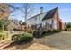 Rear exterior view of a home with a large deck and well maintained yard with a fence at 2885 Towne Village Dr, Duluth, GA 30097