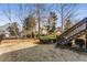 Spacious backyard featuring a black fence and wooden stairs at 2885 Towne Village Dr, Duluth, GA 30097