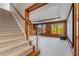 Carpeted stairway leading to the lower level Gathering room with bright windows at 2885 Towne Village Dr, Duluth, GA 30097