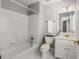 Bathroom featuring a white vanity and shower-tub combo at 2885 Towne Village Dr, Duluth, GA 30097
