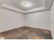 A spacious empty room with tray ceiling and neutral walls, ready for customization and transformation at 2885 Towne Village Dr, Duluth, GA 30097