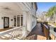 Spacious porch showcasing an entry door and an abundance of windows for plentiful natural light at 2885 Towne Village Dr, Duluth, GA 30097