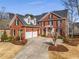 Beautiful brick home with an attached two-car garage and well-manicured landscaping at 2885 Towne Village Dr, Duluth, GA 30097