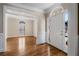 Bright foyer with hardwood floors, white door and trim, and large windows at 2885 Towne Village Dr, Duluth, GA 30097
