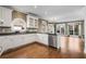 Bright kitchen featuring white cabinets, black granite countertops, and stainless steel appliances at 2885 Towne Village Dr, Duluth, GA 30097