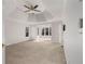 Large main bedroom with tray ceiling and a view of an adjoining sunroom through a doorway at 2885 Towne Village Dr, Duluth, GA 30097