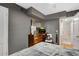 Cozy bedroom featuring gray walls, wood dresser, and decorative mirror above at 327 3Rd Ne St # 1, Atlanta, GA 30308