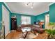 Cozy living room featuring hardwood floors and an L-shaped leather sofa at 327 3Rd Ne St # 1, Atlanta, GA 30308