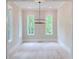 Bright living room with hardwood floors, white trim, recessed lighting, and large windows at 002 White St # 2, Marietta, GA 30060