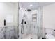 Modern bathroom featuring stylish marble tile shower and sleek black fixtures at 1416 Mcpherson Se Ave, Atlanta, GA 30316