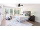 Bright bedroom featuring a large rug, neutral color palette, ceiling fan, and lots of natural light at 1416 Mcpherson Se Ave, Atlanta, GA 30316