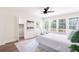 This bedroom features a ceiling fan, sitting area, and lots of natural light from the backyard views at 1416 Mcpherson Se Ave, Atlanta, GA 30316