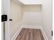 Walk-in closet with wood laminate flooring and painted white trim at 1416 Mcpherson Se Ave, Atlanta, GA 30316