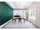 Open dining room with decorative wall, light fixture, and hardwood flooring at 1416 Mcpherson Se Ave, Atlanta, GA 30316