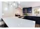 Modern kitchen featuring a large quartz countertop, stainless steel appliances, and navy blue cabinetry at 1416 Mcpherson Se Ave, Atlanta, GA 30316