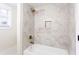 Bathroom featuring a shower with neutral colored tiling and niche at 1416 Mcpherson Se Ave, Atlanta, GA 30316