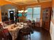 Inviting dining area showcasing an ornate chandelier, a table set for a meal, and warm, earthy toned walls at 150 Bellemeade Ct, Fayetteville, GA 30215