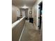 Upstairs hallway, well lit with natural light and neutral paint color, offering views of the upstairs rooms at 150 Bellemeade Ct, Fayetteville, GA 30215