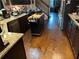 Kitchen featuring dark wood cabinets, granite counters, and hardwood floors at 150 Bellemeade Ct, Fayetteville, GA 30215