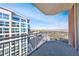 Spacious balcony showing railing and views of city buildings in the distance at 1820 Peachtree Nw St # 1207, Atlanta, GA 30309