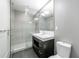 Sleek bathroom with a glass-enclosed shower and modern vanity at 1820 Peachtree Nw St # 1207, Atlanta, GA 30309